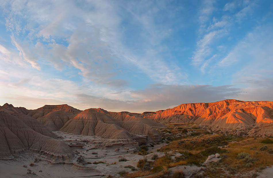 Early morning light glows over buttes in Toadstool Park.