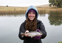 Female angler holding a trout at Fort Robinson State Park