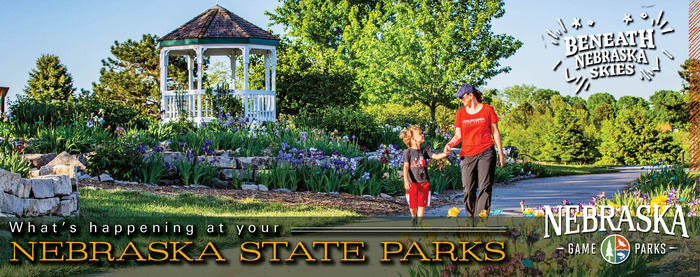 People walking through the iris garden at Mahoney State Park; text: "What's happening at your Nebraska state parks"