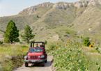 Couple riding a jeep through Fort Robinson State Park