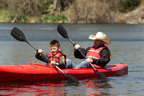 Father and son kayaking at the Kearny Expo