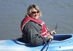 Woman smiling while kayaking