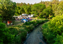 Overhead view of a campground at Long Pine SRA with river nearby winding through trees