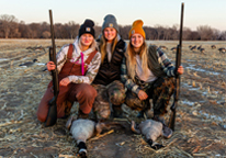 Women posing during a Becoming an Outdoors-Woman hunt