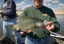 Closeup of angler holding a crappie caught in Flanagan Lake