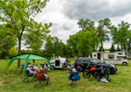 People gathered around a campsite at Victoria Springs State Recreation Area