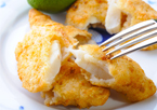 Closeup of fish fillets on a plate with a fork