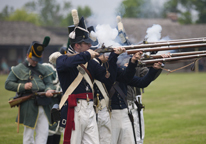 Soldiers at Fort Atkinson firing muskets