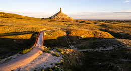 A trail with Chimney Rock in the background