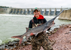 Female angler holding a paddlefish