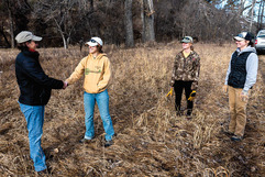 Landowner and hunter shaking hands