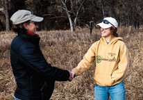 Landowner and a hunter shaking hands