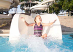 A girl goes down a big waterslide at Eugene T. Mahoney State Park