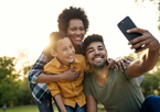 A family taking a selfie in the outdoors