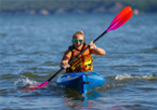 Woman paddling a kayak in the Crofton's Dam Race