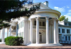 Exterior of Arbor Lodge Mansion, with large white column pillars