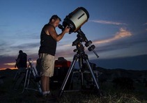 Man using a telescope at the Nebraska Star Party