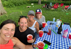 Friends gathered around a picnic table