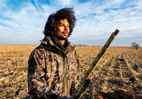 Elijah Riley in a field hunting geese