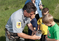 Park superintendent working with children