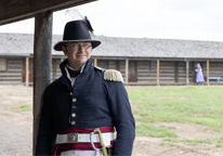 Military reenactor poses at Fort Atkinson