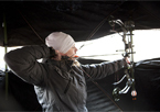 Woman shooting a bow