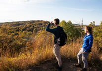 Father and son hiking at Indian Cave State Park in the fall