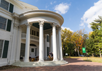 Exterior of Arbor Lodge Mansion near trees with fall color