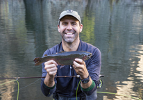 Man holding up a rainbow trout