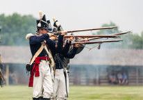 Reenactors at Fort Atkinson firing muskets