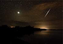 A shooting star arcs above Enders Reservoir