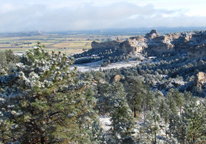 Snowy landscape of trees and buttes at Wildcat Hills State Recreation Area