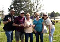 Group of couples at Sip Nebraska with wine glasses