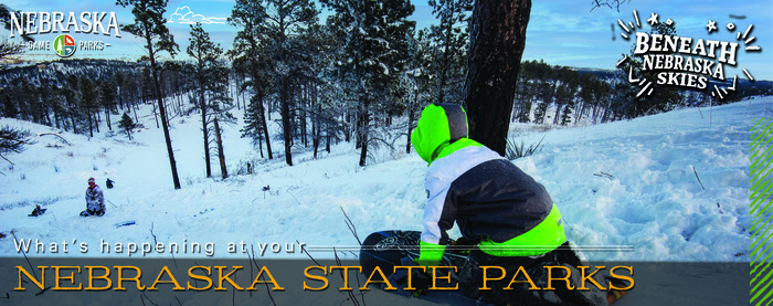 Boy riding a sled at a Nebraska state park, with text "What's happening at your Nebraska state parks"