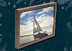 A framed photo of a sailboat on a holiday background