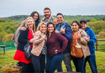 Group of friends pose together at Sip Nebraska