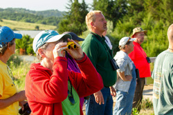 Lady with binoculars watching wildlife
