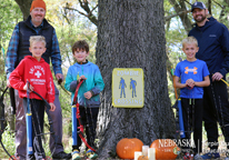 A family on a Halloween-themed outdoor archery course