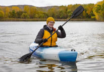 Woman kayaking in autumn
