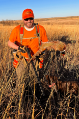 Man holding his Upland Slam harvest