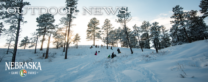 Header with "Outdoor News," Game and Parks logo and picture of snowy hill in the woods