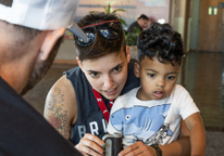Small child with his mom at a Game and Parks workshop