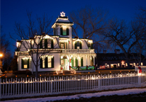 The Cody Mansion lit up in Christmas lights