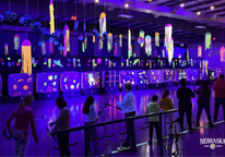 Archery under black lights at the Turpin Outdoor Education Center