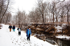 People hiking in winter along the Platte River