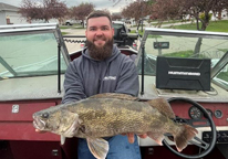 Man holding a state record saugeye