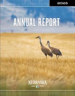 The annual report cover shows a sandhill crane.