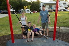 A family playing on the swings at a Nebraska state park