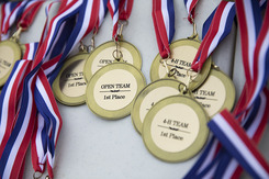 A collection of medals for a youth target event on a table