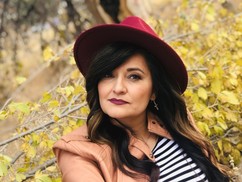 Esther Garcia, a young woman wearing a red hat